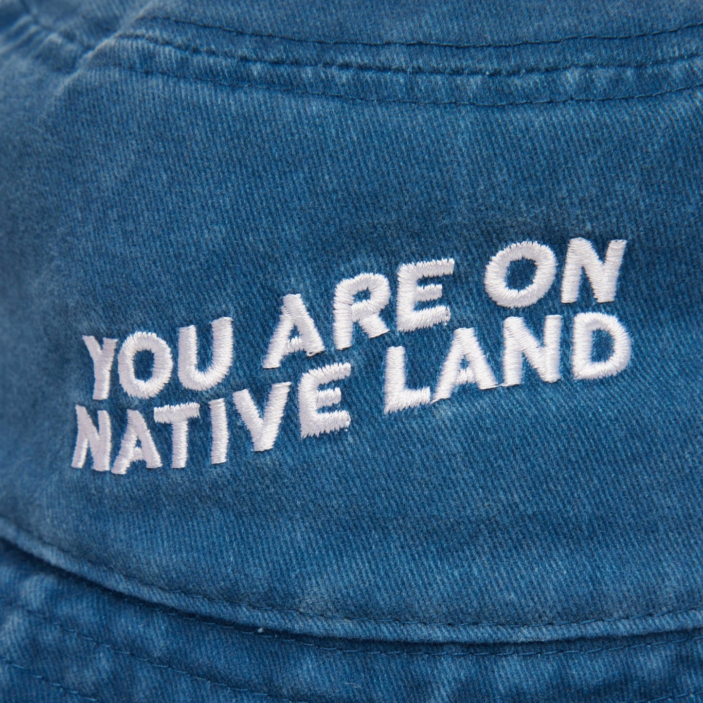 'YOU ARE ON NATIVE LAND' BUCKET HAT - Osadia Concept Store