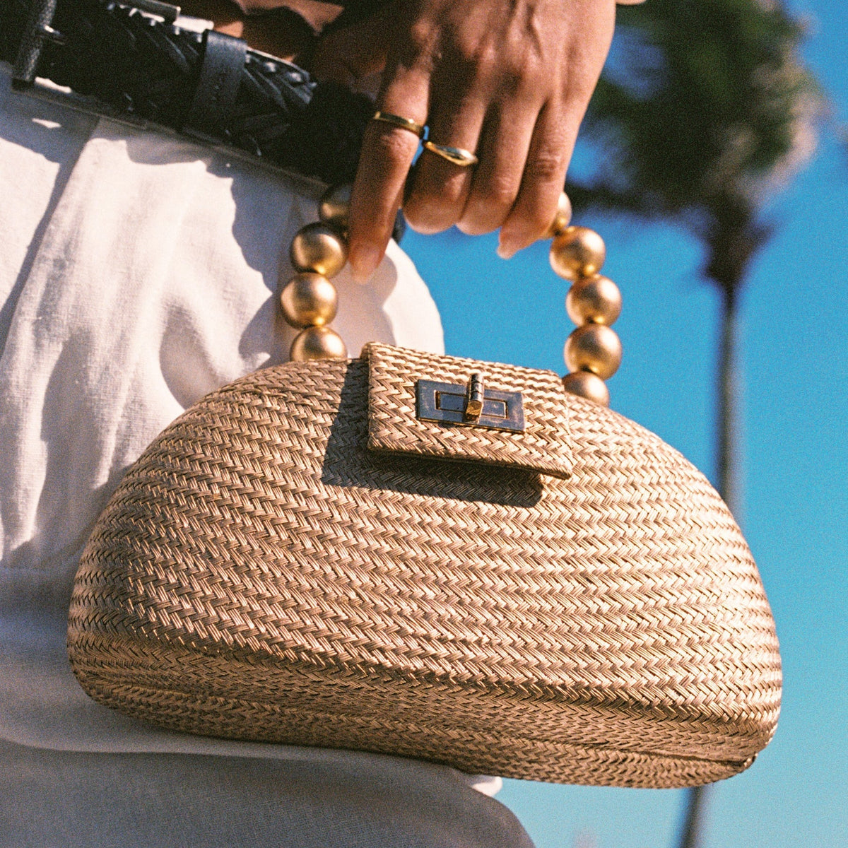 THE ORLA Gold Woven Straw & Wooden Bead Statement Clutch Bag